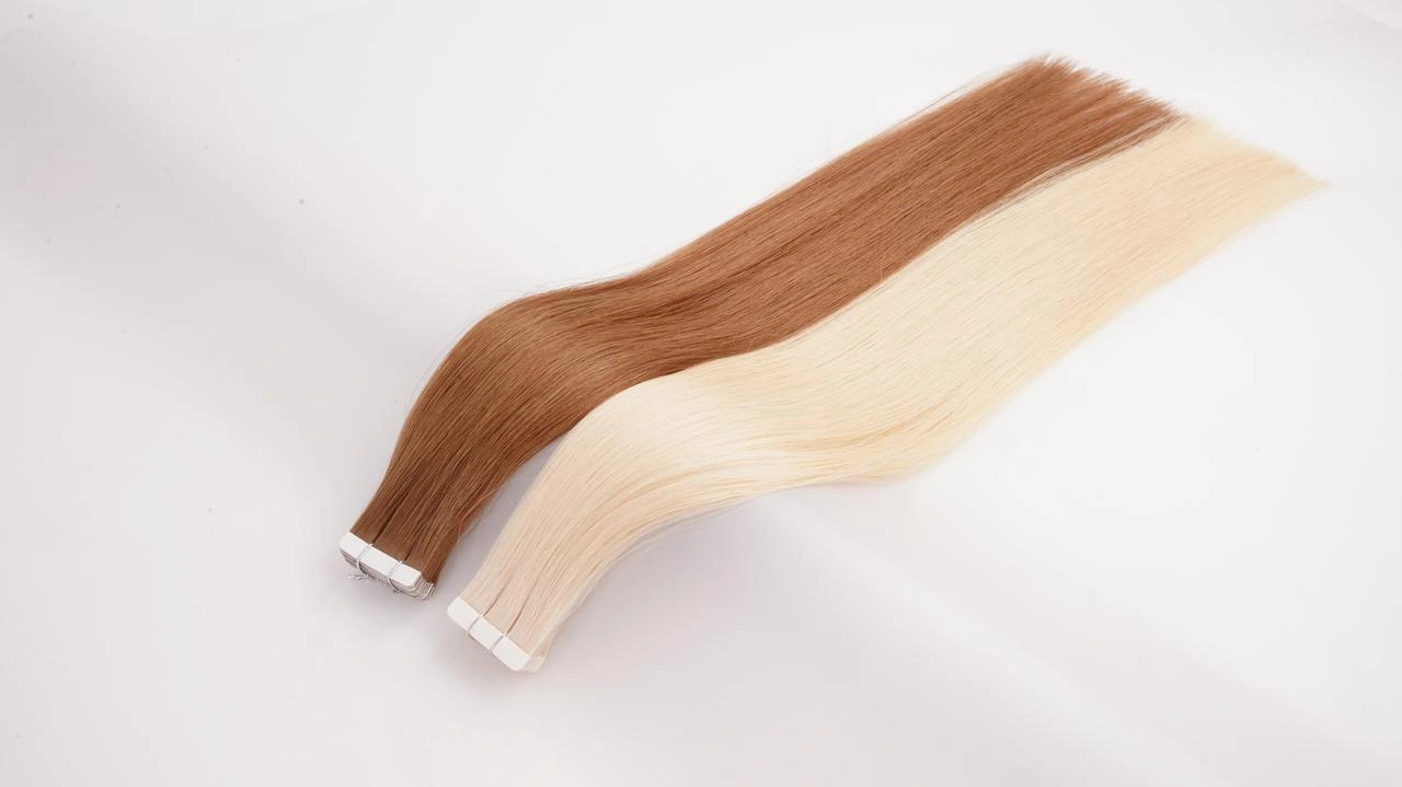 Tape-in hair extensions in warm brown and blonde shades, shown as lightweight, remy human hair options for fine-hair salon clients.