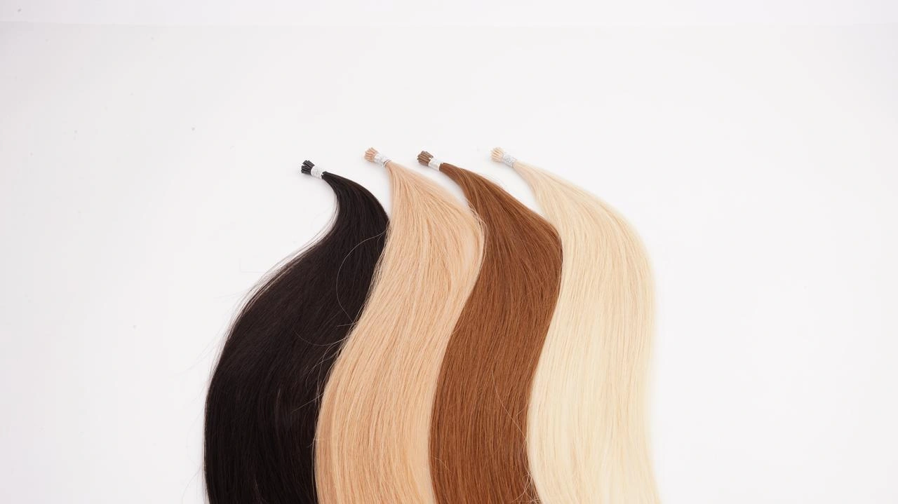 I-Tip Remy human hair extensions in dark brown, blonde, warm brown, and light blonde shades, shown as strand-by-strand options for fine-hair salon clients.