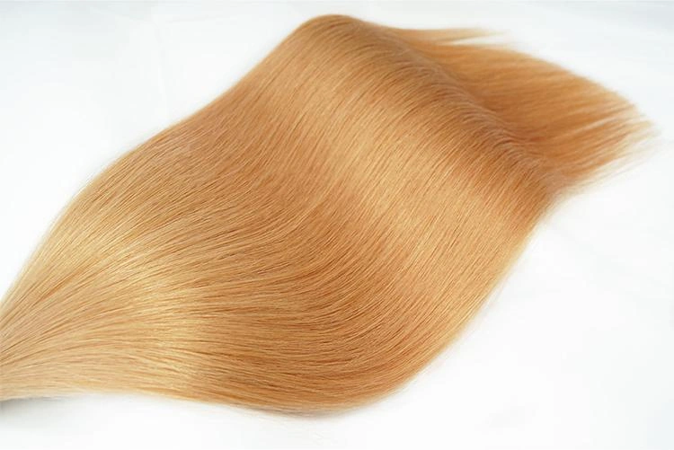 Light golden blonde Remy human hair extension sample showing smooth straight texture and natural shine