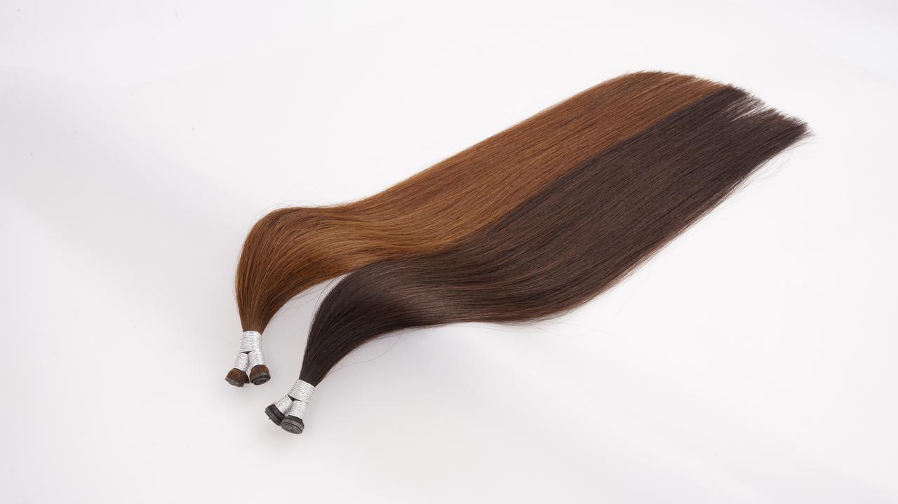 Brown Remy human hair weft extension samples showing smooth straight texture for professional salon use